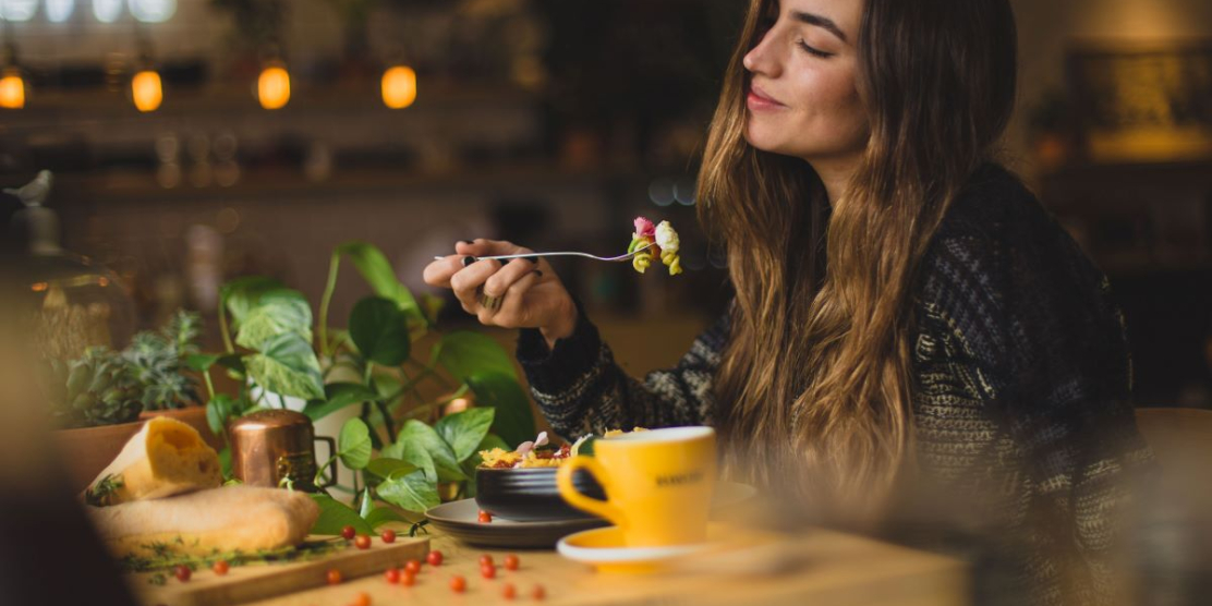 Happy woman eating
